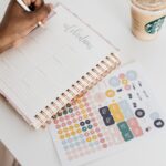 A person using a planner to organize tasks and support focus