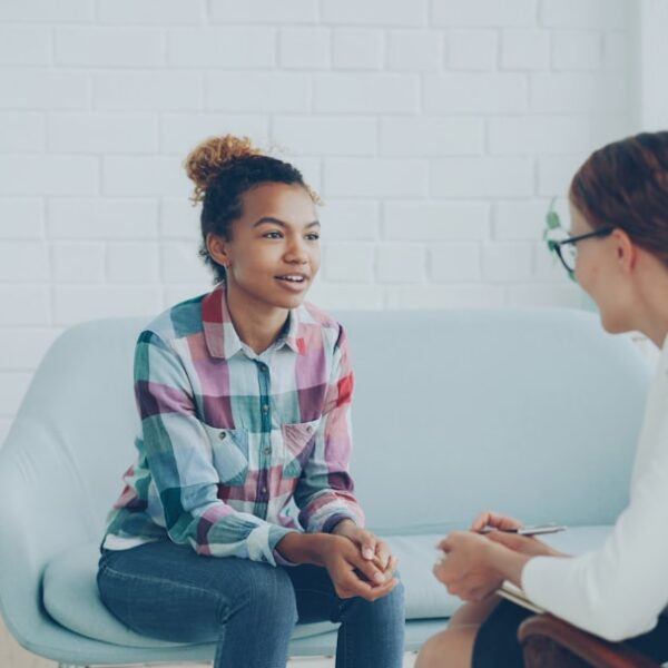 A client having a supportive conversation with a mental health professional