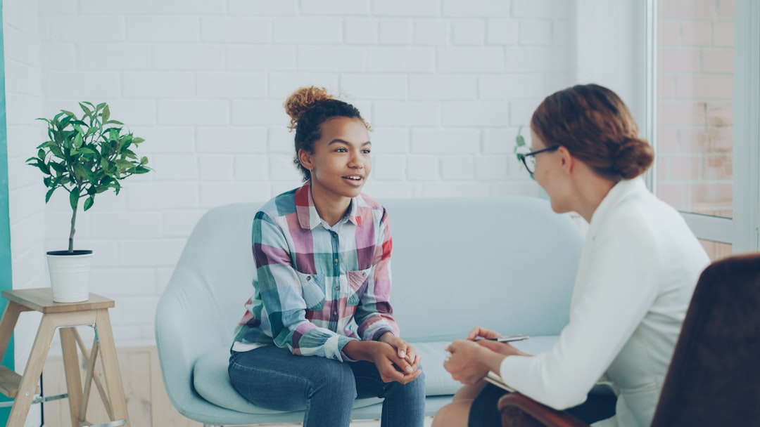 A client having a supportive conversation with a mental health professional