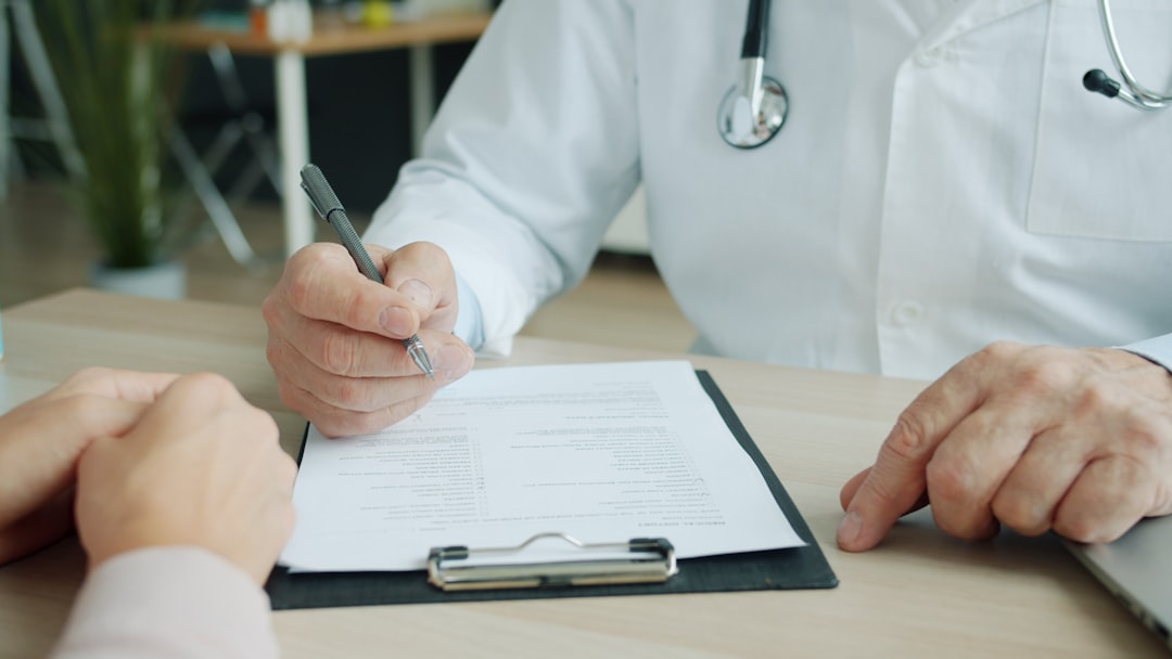 A clinician listening to an adult patient during a thoughtful psychiatric evaluation